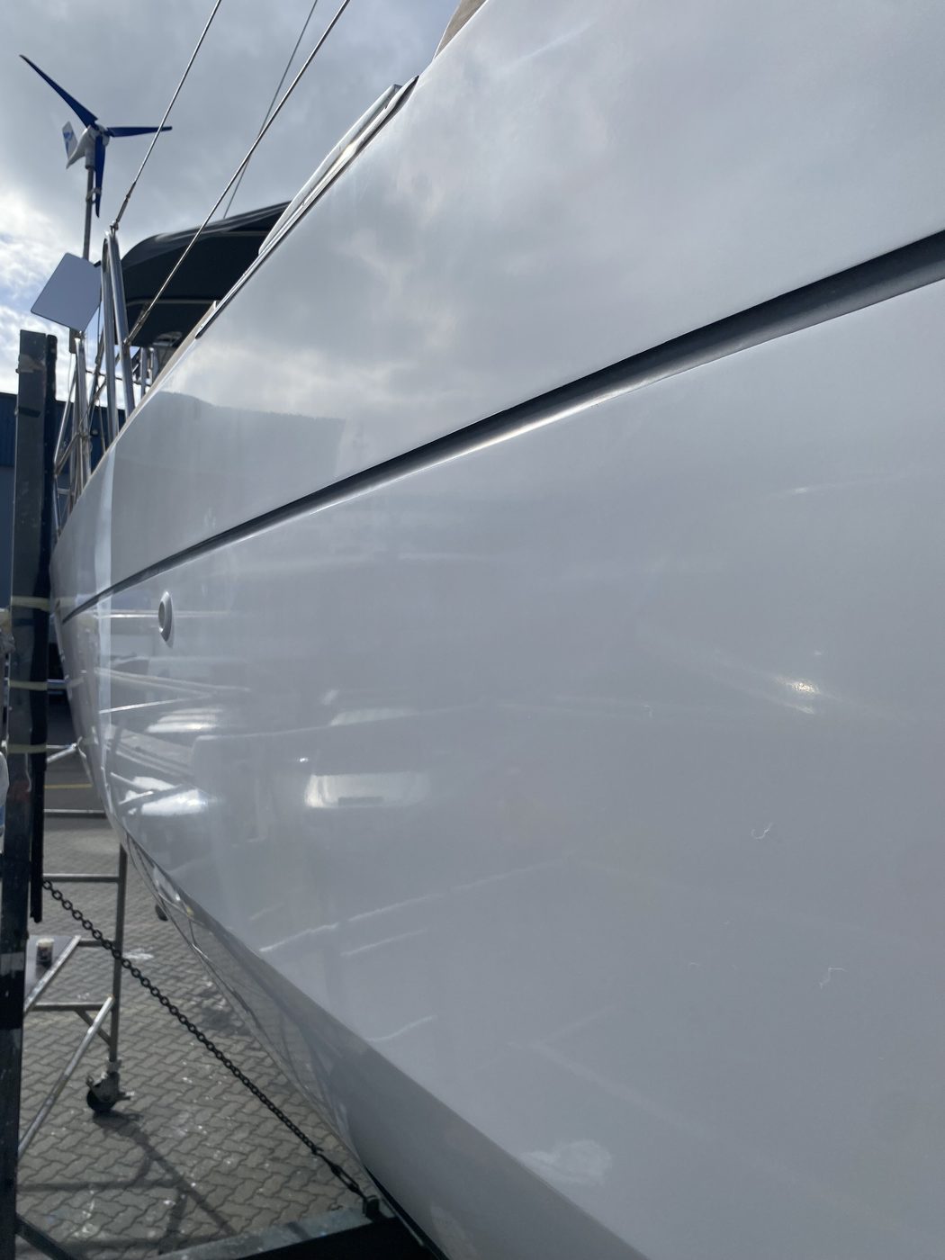 Boat bow and chine with high gloss finish on trailer, Brisbane