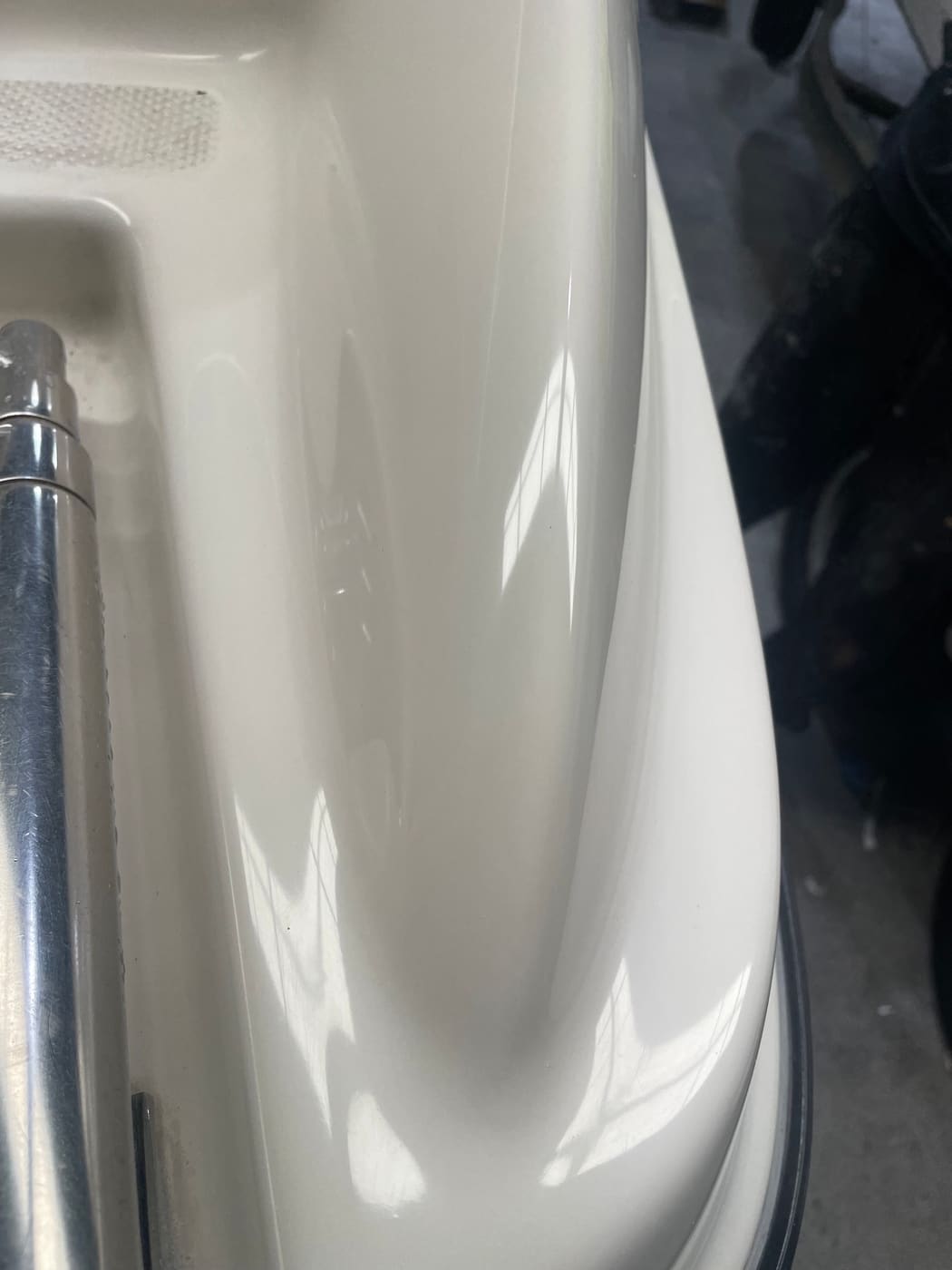 Boat gunwale filled, re-gelcoated and polished with the chip no longer visible, Brisbane