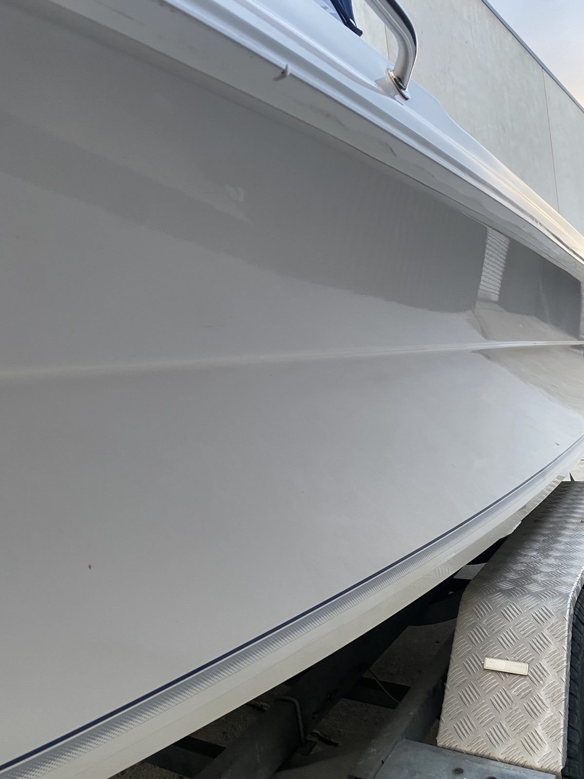 Boat gunwale and deck edge with restored gloss, Brisbane