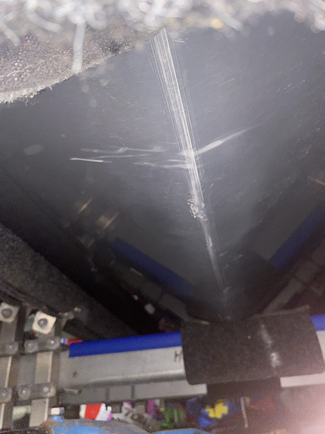 Deep scratching and scuffed gelcoat along a boat hull strake before repair, Brisbane