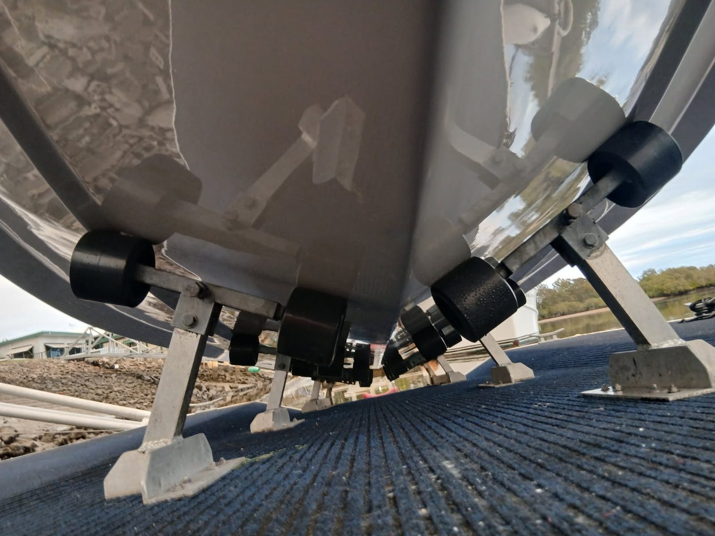 Polished boat hull on slipway rollers, Brisbane