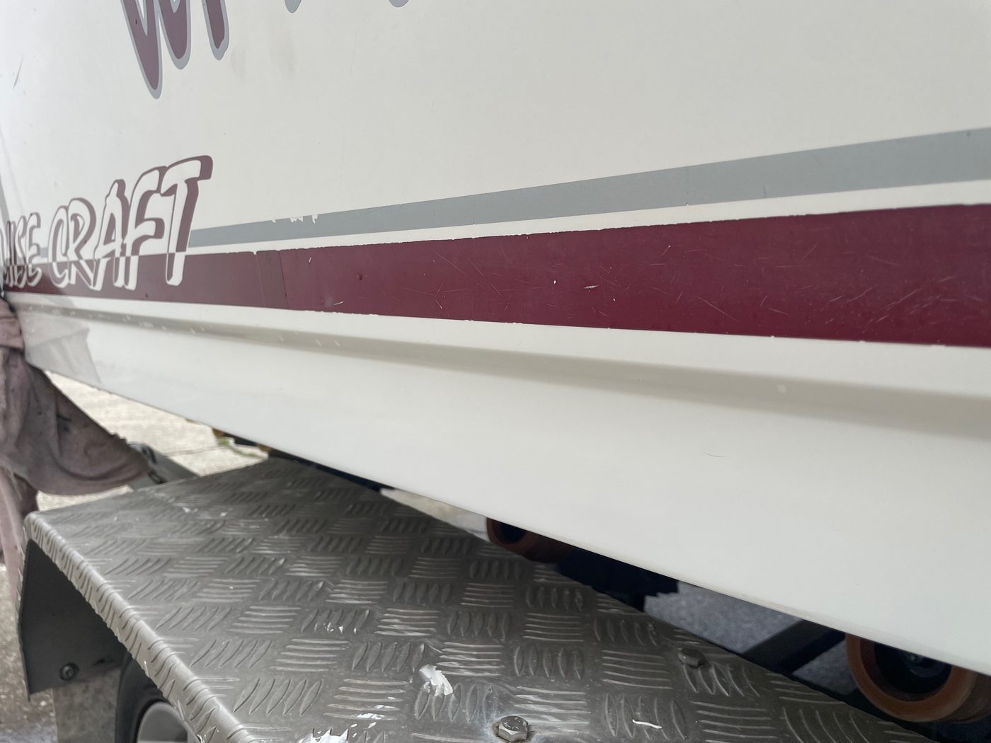Boat hull side and strake repaired and polished with the scratch no longer visible, Brisbane