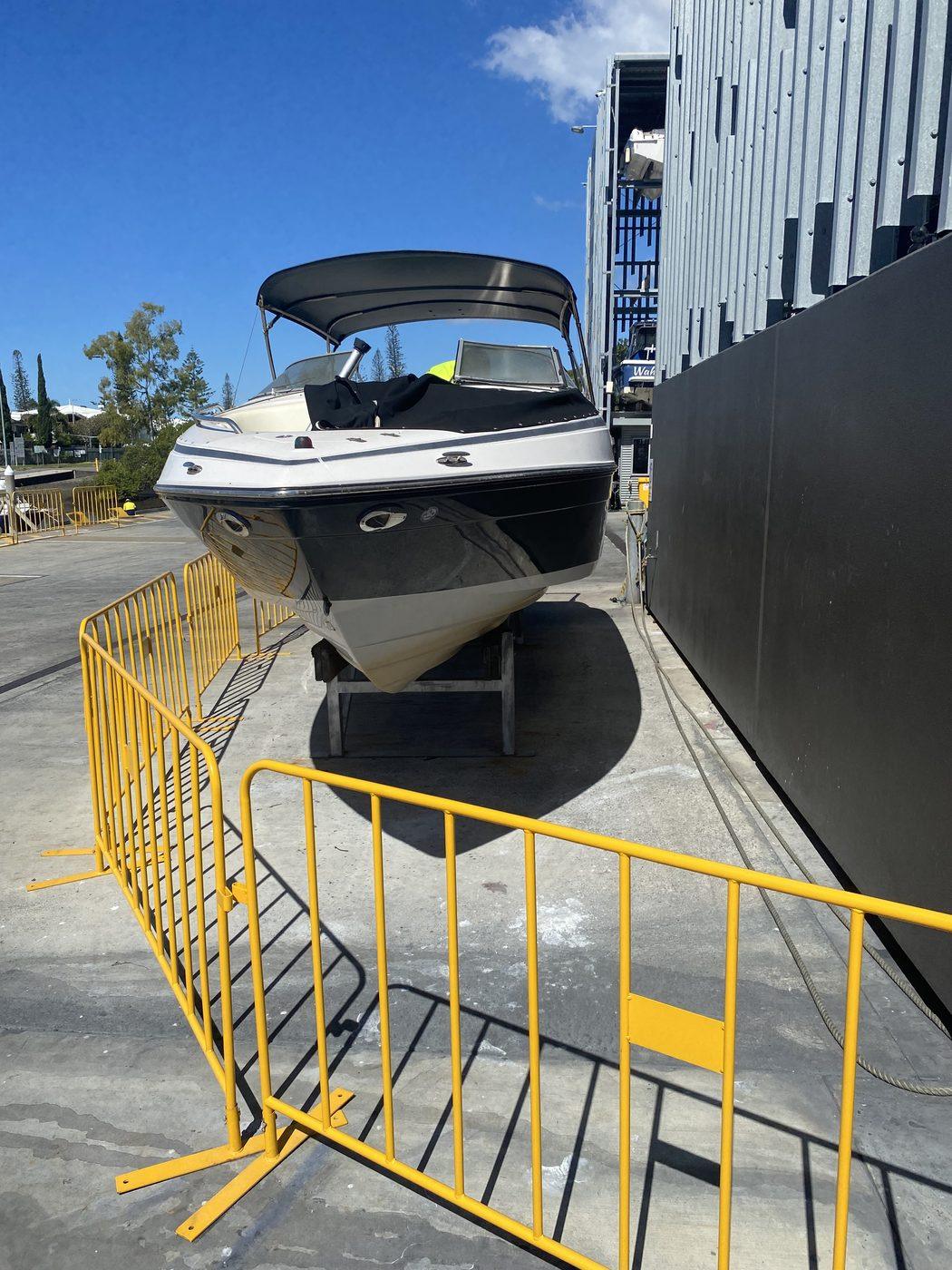 Bowrider on stands in the boatyard for fibreglass work, Brisbane