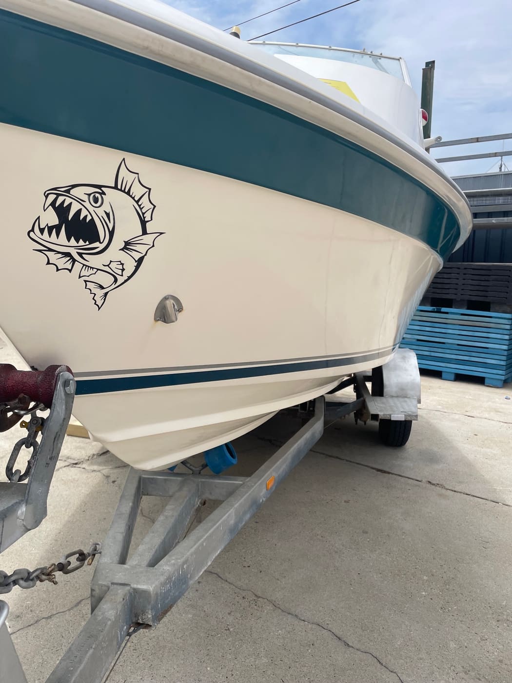 Centre console boat bow and topsides with a restored gloss finish on the trailer, Brisbane