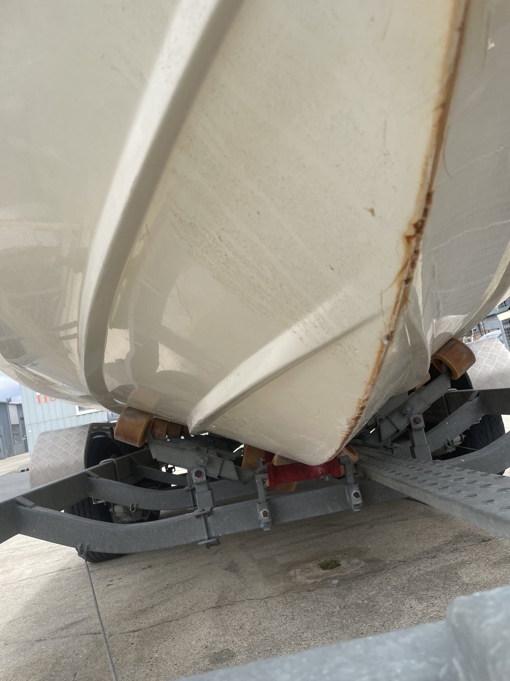 Cruise Craft boat keel stained and worn along the trailer rollers before fibreglass repair, Brisbane