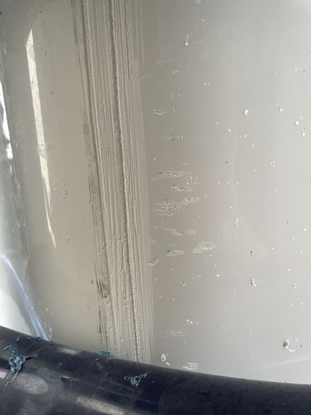 Boat chine and planing strake gouged and abraded through the gelcoat before fibreglass repair, Brisbane
