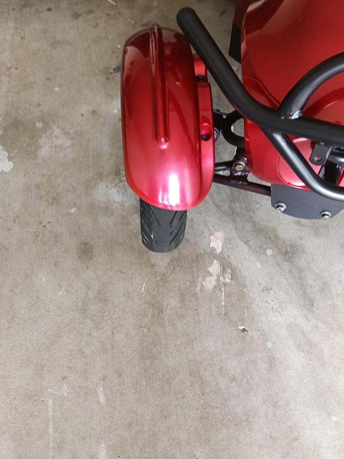 Mobility scooter mudguard repaired and refinished in gloss red, Brisbane