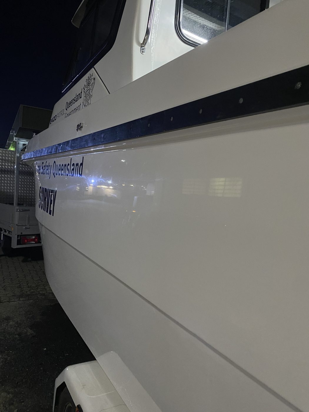 High gloss polished hull with Maritime Safety Queensland decals, Brisbane