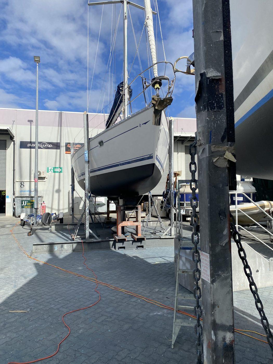 Sailboat on the hardstand after cut and polish, Brisbane boatyard