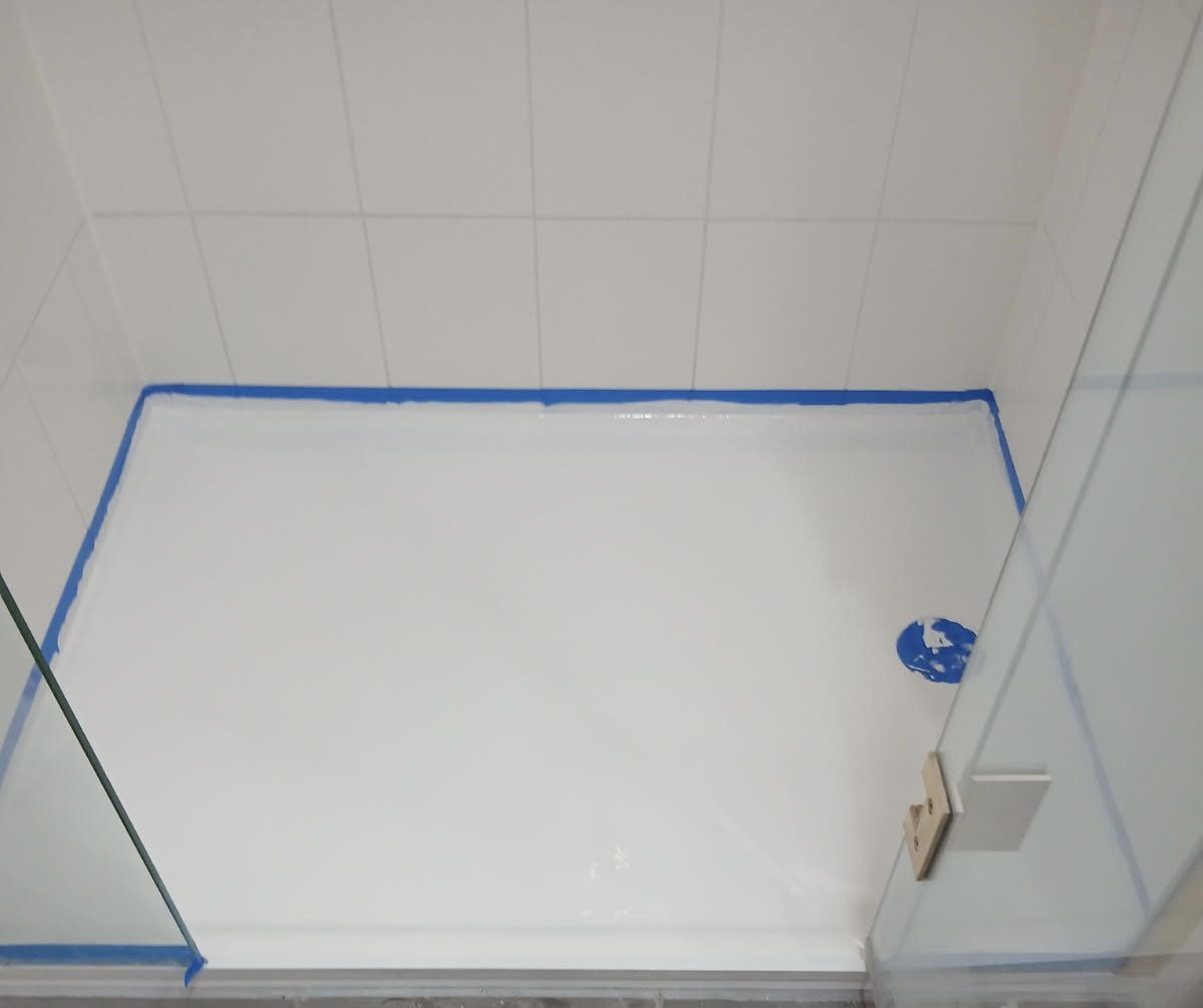 Shower base re-coated with fresh white finish after fibreglass repair, Brisbane