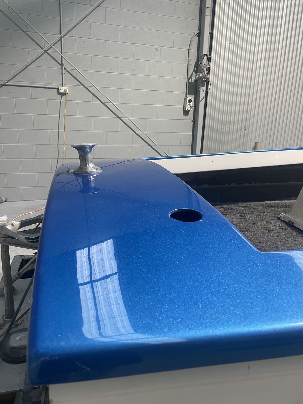 Ski boat bow deck and cleat finished in blue metal-flake with a gloss reflection, Brisbane