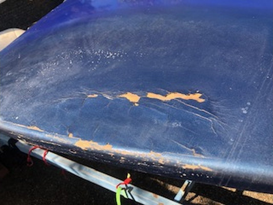 Clinker ski boat top deck with flaking, chalked blue finish lifting back to primer before respray, Brisbane