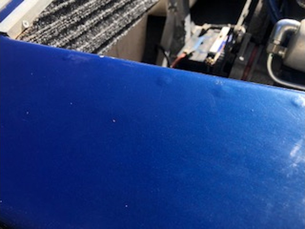 Ski boat gunwale with a flat, faded blue finish before respray, Brisbane