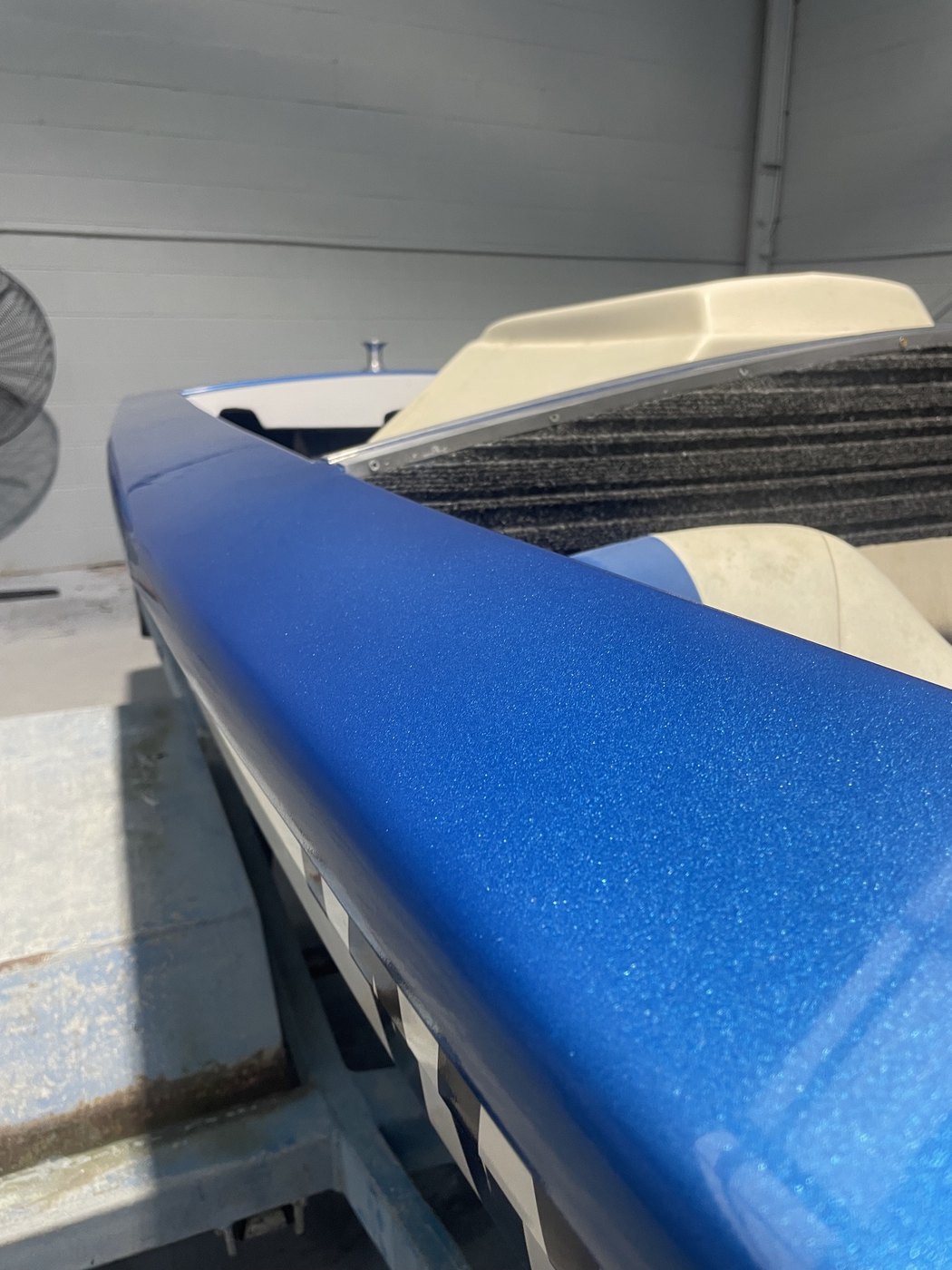 Ski boat gunwale line resprayed in blue metal-flake running the length of the hull, Brisbane