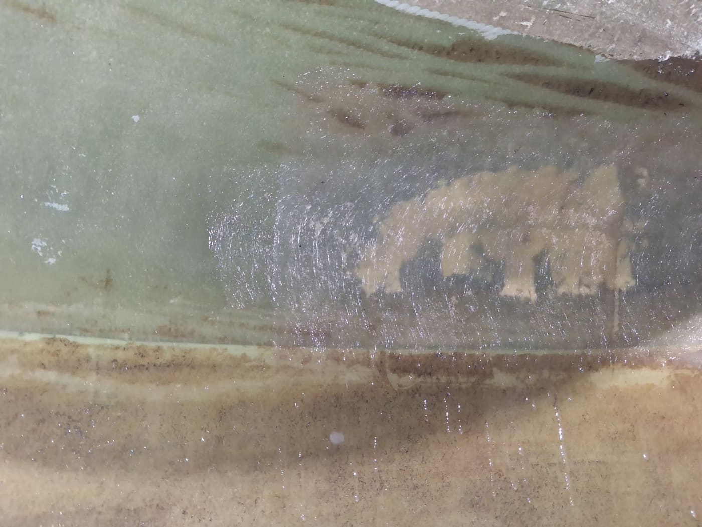 Fibreglass reinforcement laminated over a crack in the internal wall of a water tank, Brisbane